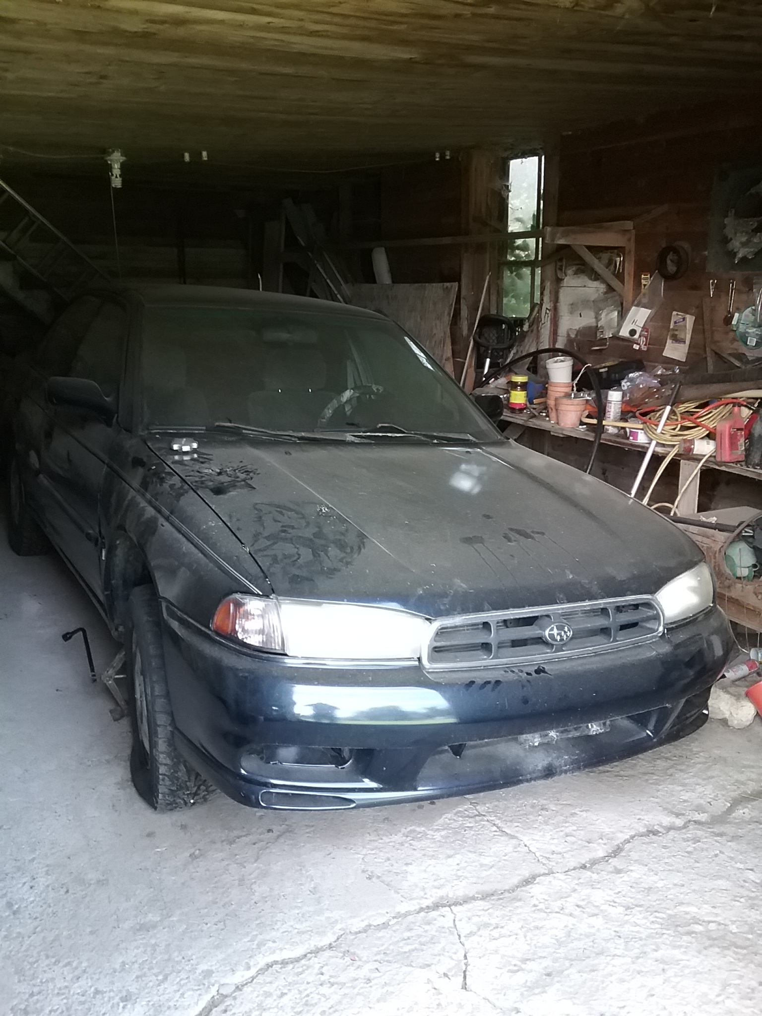 Subaru in the barn looking typical hick. Me! Who would believe it?